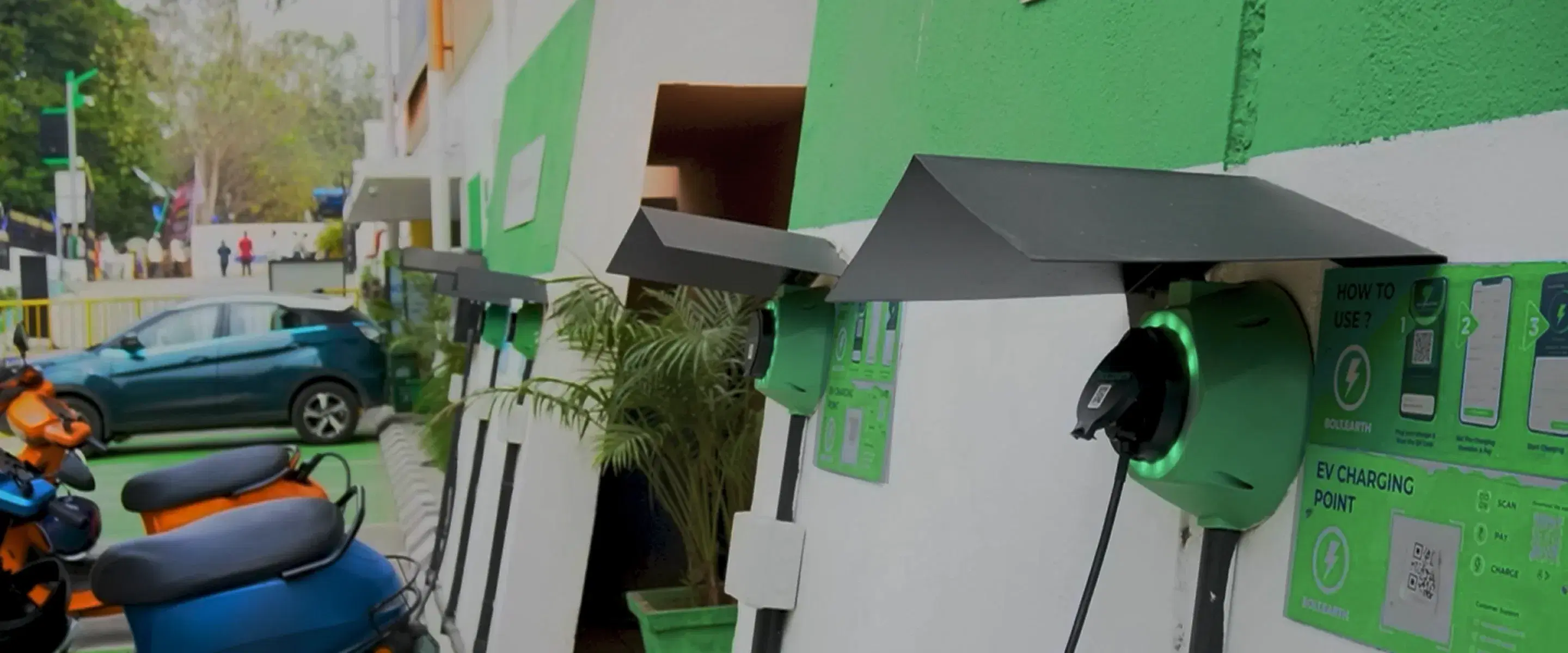 EV Charging Station With Scooters and Car Enabling Easy Charging.